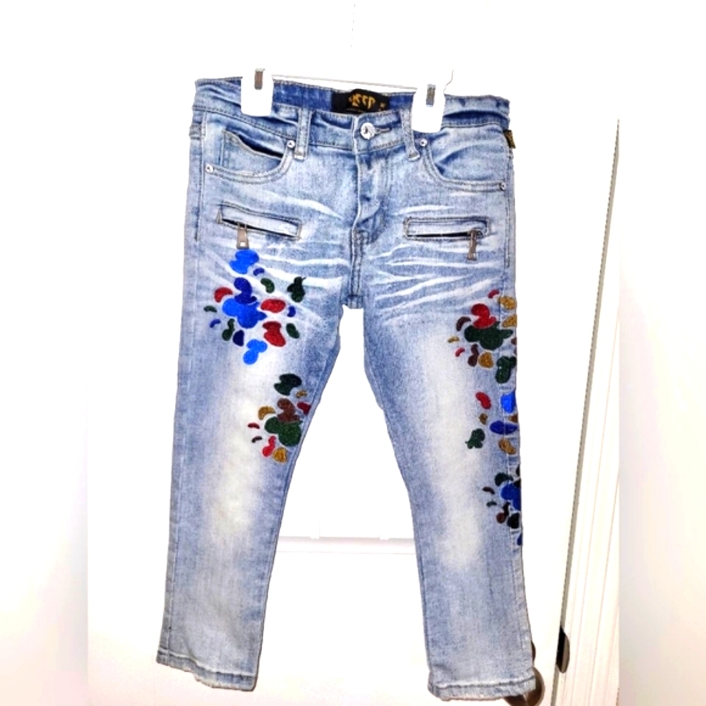Size: 5/6 boys Kleep light wash jeans with multicolor design embroidery.